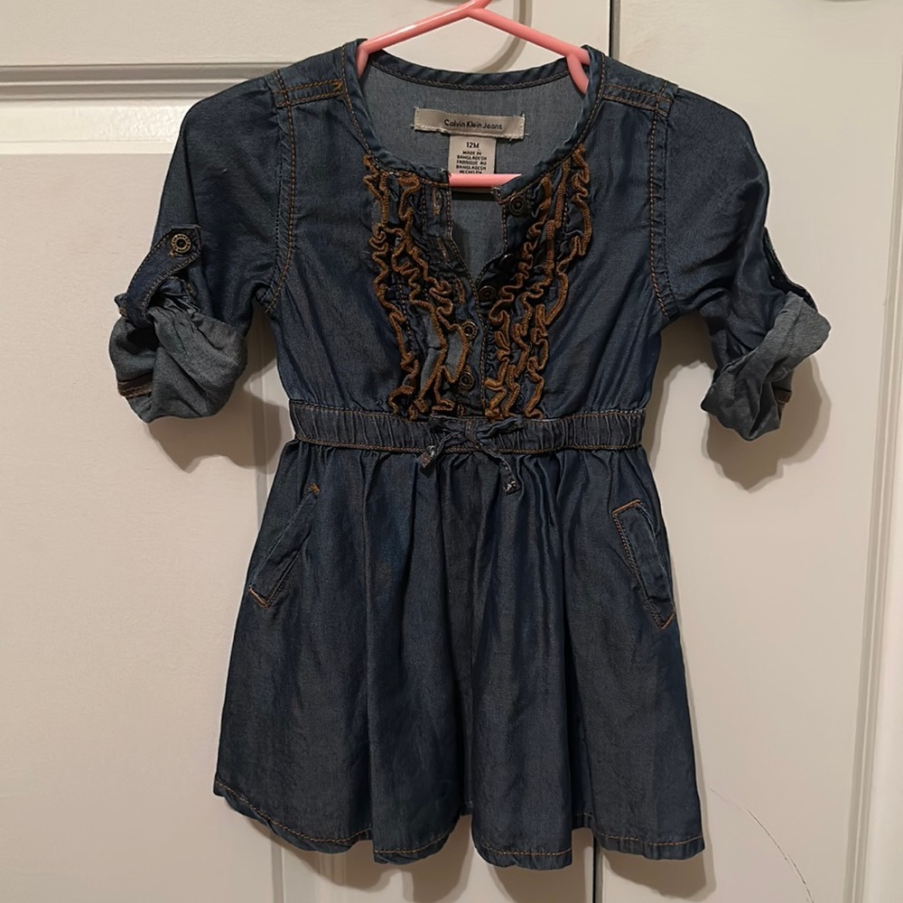 Calvin Klein Jeans denim color dress. Ruffle front with pockets